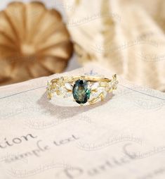 a close up of a ring on top of a book