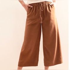 Banana Republic Wide Leg Cropped Pants New With Tags Size Xs Fabric: 55% Linen, 45% Rayon/Viscose Color: Spice (Burnt Orange Or Rust Color) High Rise, Relaxed Fit Through Hip And Thigh, Wide Leg Elastic Waist With Drawstring Tie With Cute Tassels Smoke Free, Pet Free Home Brown Cropped Leg Bottoms For Spring, Brown Cropped Leg Pants With Pockets, Brown Cropped Pants With Pockets, Orange Wide-leg Loungewear Bottoms, Orange Wide Leg Relaxed Fit Pants, Orange Wide Leg Pants With Relaxed Fit, Brown Cropped Leg Pants For Spring, Orange Wide-leg Pants For Loungewear, Orange Wide Leg Bottoms With Relaxed Fit