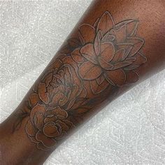 a person with a flower tattoo on their arm