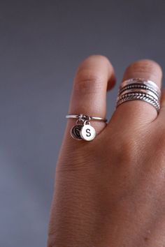 "This lovely cute ring is made from sterling silver. It has TWO initial charms of your choice.It can have two initials or ONE initial and ONE heart charm. This ring is lovely to wear on its own or stack it together with other rings. The charm is solid silver and is about 7mm big and 1.5mm thick. Please leave your wanted size of the ring and the initials you want at the checkout \"Notes to Seller\" Thank you for choosing hand made. :) Edite Best regards Edite" Ring With Initials, Silver Initial Ring, Charm Ring, Custom Jewellery, Sterling Silver Stacking Rings, Sterling Silver Initial, Ring Hand, Silver Stacking Rings, Ring Ideas