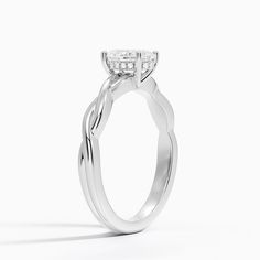 a white gold engagement ring with an oval cut diamond