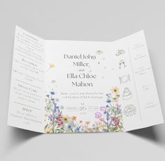 an open wedding program with flowers on the front and back cover, in white paper