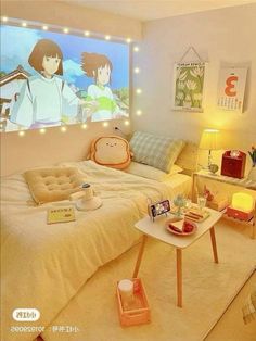 a room with a bed, desk and tv in it's corner area that has anime pictures on the wall