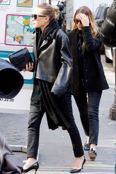 two women walking down the street together