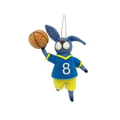 a stuffed animal hanging from a string with a basketball in it's hand,