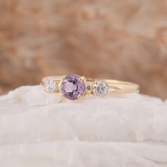 "Womens dainty 3 stone setting amethyst engagement ring, Simple 14k yellow gold amethyst promise ring for her, Amethyst womens wedding ring WE OFFER UNLIMITED PERIOD INSTALLMENTS PLAN This is a beautiful, stunning, feminine ring that works well for all occasions, styles, and ages. You will love it! Ring information Main stone: Amethyst Approximate size: 4.5mm Accent stone: Cubic zirconia Approximate size: 3mm Metal type: Gold Metal stamp: 14k solid gold Customization / Replacements It's easy to Purple Sapphire Ring In 14k Gold For Wedding, Purple Birthstone Promise Ring In 14k Gold, Purple 14k Gold Promise Birthstone Ring, Dainty 14k Gold Amethyst Ring For Wedding, Purple 14k Gold Birthstone Wedding Ring, Purple Three Stone Wedding Jewelry, Round Amethyst Three Stone Promise Ring, Elegant Three Stone Amethyst Promise Ring, Round Three Stone Amethyst Promise Ring