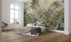 a bedroom with a large mural on the wall