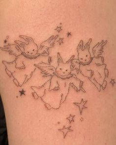 an image of a tattoo on the back of a woman's shoulder with angels and stars