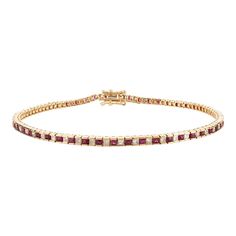 This is part of Chairish’s Fine Jewelry assortment.  This Ruby and Diamond Sleek Tennis Bracelet in 18K gold showcases 1.7 carats endlessly sparkling natural ruby and 1.26 carats of diamonds. It measures 7.5 inches long in length.  Ruby improves mental strength.  Designed with perfect square cut ruby alternatingly set with a diamond to make you stand out on any occasion or event. The elegant style complements the attire beautifully and is a perfect Engagement Gift, Bridal Shower Gift, Gift For L Classic Ruby Tennis Bracelet For Anniversary, Classic Ruby Gemstone Tennis Bracelet, Elegant Ruby Tennis Bracelet In Yellow Gold, Elegant Yellow Gold Ruby Tennis Bracelet, Classic Ruby Tennis Bracelet With Jubilee Design, Classic Ruby Tennis Bracelet For Formal Occasions, Elegant Ruby Tennis Bracelet For Formal Occasions, Fine Jewelry Ruby Tennis Bracelet With 17 Jewels, Ruby Tennis Bracelet In Yellow Gold For Anniversary