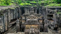 an intricately carved structure in the middle of a cave