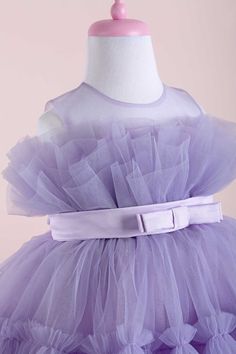 THA Dressing presents the amazing Diana Collection! Mothers and daughters love this magic model that we designed in 8 different colors! Layered tulle is finished with a gorgeous satin belt. Glamorous, fluffy, special and absolutely adorable! Details Fabric: Dream tulle, crystal tulle, cotton lining Light lilac dress Sleeveless dress Light lilac illusion collar The chest is made of multi-layered tulle Light lilac bow belt at the waist Tulle layered ruffle detail crinoline Knee-length skirt Sugges Lilac Party, Daughters Love, Toddler Girl Christmas Dresses, Sequin Dress Outfit, Girls Gold Dress, Purple Flower Girl Dress, Girl Green Dress, Purple Girls Dress, Flower Girl Dresses Blue