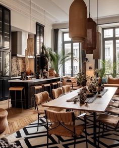 a large dining room with lots of furniture and plants in it's centerpiece