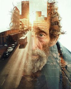 an old man's face is shown in front of a city street with tall buildings