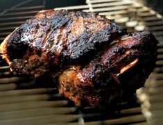 two meats are cooking on the grill with no one around them or they're ready to be grilled