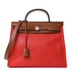 This is an authentic HERMES Toile H Berline Vache Hunter Herbag Zip 31 PM in Naturel and Rouge H. This stylish tote is crafted of sturdy toile canvas in brown and red. It features a rear exterior zip pocket, a brown leather top crest with a leather top handle, shoulder strap and strap closure with palladium hardware. This bag opens to a toile canvas interior with a matching removable pouch. Designer Red Coated Canvas Bag, Red Top Handle Shoulder Bag In Coated Canvas, Red Coated Canvas Top Handle Shoulder Bag, Red Luxury Bags With Leather Handles, Luxury Red Bags With Leather Handles, Luxury Canvas Bags With Leather Lining, Designer Red Bags With Leather Trim, Red Coated Canvas Satchel Shoulder Bag, Red Coated Canvas Bag With Double Handle