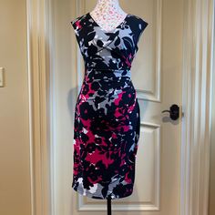 Very Pretty Sleeveless Dress With A Black, Gray, White And Magenta Flower Patterned Jersey Material, With A Gray, Full Lining. Ruched Detail On One Side. Very Versatile Piece And Flattering Style That Drapes Beautifully. Wear It To Work, On Date Night Or Lunch With Friends. You’ll Get Loads Of Compliments! Size 4 Nwot. Pristine Condition Elegant Black Sleeveless Floral Dress, Pink Fitted Sleeveless Floral Dress, Casual Black Sleeveless Floral Dress, Black Fitted Sleeveless Floral Dress, Fitted Multicolor Sleeveless Floral Dress, Multicolor Fitted Sleeveless Floral Dress, Fitted Black Sleeveless Dress With Floral Print, Chic Black Sleeveless Floral Dress, Lunch With Friends