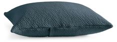 the pillow is made out of dark blue fabric