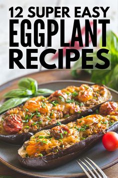 two eggplant stuffed peppers on a plate with tomatoes and basil leaves in the background