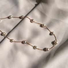 "Dainty Pearl Necklace, 18K Gold Choker Necklace, White South Sea Pearl Chain Necklace, Spaced Pearl Necklace, Valentine's Gift Product Details :- Gross Weight : 17.50 Gram Stone Weight : 70.70 CTS Pearl Size : 9 MM  Pearl Color : White  No. of Pearl : 13 \"Elevate your style with our Dainty Pearl 18K Choker Necklace. Delicately layered, this South Sea Spaced Bead Necklace in 18K gold is a timeless and elegant accessory, perfect for gifting on Valentine's Day.\"" Gift Yellow Gold Pearl Necklace With Chain, Yellow Gold Pearl Necklace Chain As Gift, White Necklaces With Gold Chain For Formal Occasions, Classic White Beaded Chain Necklace, Formal White Necklaces With Gold Chain, White Gold Chain Necklace For Formal Occasions, Gold Jewelry With Pearl Snake Chain, Gold Snake Chain Jewelry With Pearl Detail, Gold Snake Chain Jewelry With Pearl Chain