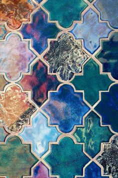 an artistic tile design with many different colors