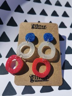 Red, white & blue earrings, Ideal for the Kings Coronation, show some patriotic pride in these limited edition statement earrings. These earrings are big and bold, but still very light and comfortable to wear. They make a statement with their triple drop and the pop of colourful glitter. 🌟 Hand-mixed, hand-poured resin 🌟 Stainless steel earring back posts with stainless steel butterflies 🌟 Custom glitter mix - please note this is NOT my usual biodegradable glitter 🌟 No two pairs are alike De Blue Patriotic Earrings For Independence Day, Patriotic Blue Earrings For Independence Day, Patriotic Multicolor Earrings For Independence Day, Patriotic Drop Earrings Jewelry Gift, Red Dangle Earrings For 4th Of July, Blue Patriotic Drop Earrings, Patriotic Blue Drop Earrings, Handmade Blue Earrings For 4th Of July, Red Dangle Jewelry For 4th Of July