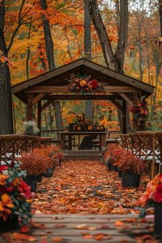 a gazebo surrounded by fall foliage and trees