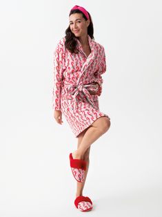 Add a festive and luxurious touch to your loungewear with Shiraleah’s Felicity Candy Cane Robe. The adorable light pink robe features a pattern of red striped candy canes tied with a green bow - perfect to wear while you open up presents by the tree. This soft and fuzzy robe features two front pockets and an adjustable wrap around belt, allowing you to be cozy and casual throughout your holiday celebrations. Pair with the matching Felicity Candy Cane Slippers, or other items from Shiraleah’s Mer Pink Cotton Sleepwear For Holiday, Spring Red Sleepwear For Lounging, Red Spring Robe For Loungewear, Fuzzy Robe, Fuzzy Fabric, Spa Wraps, Opposite Colors, Red Slippers, Red Fur