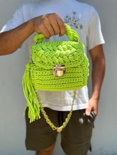 This handmade knitted green bag has a spacious interior and is a very cool piece. You can easily use this bag everywhere in your daily life. Green Trendy Crochet Shoulder Bag, Trendy Green Crochet Shoulder Bag, Green Crochet Pouch Bag For Daily Use, Green Knitted Bag For Daily Use, Green Crochet Bag With Braided Handles, Green Casual Crochet Bag Hand Knitted, Trendy Green Crochet Bag With Braided Handles, Green Knitted Shoulder Bag For Daily Use, Handmade Green Crochet Shoulder Bag