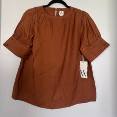 Rusty Brown (Tortoise Brown On Tag) Never Worn Button Sleeves 50% Rayon 50% Polyester Pet And Smoke Free Brown Buttoned Blouse For Work, Brown Blouse With Buttons For Workwear, Brown Workwear Tops With Button Closure, Brown Button Closure Tops For Work, Brown Tops With Button Closure For Work, Brown Summer Workwear Blouse, Brown Summer Blouse For Work, Summer Workwear Brown Blouse, Spring Brown Blouse With Button Cuffs