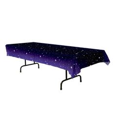 a rectangular table covered in purple and black stars