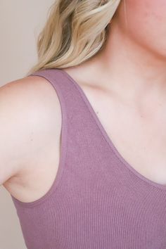 This is called our "Live In Tank" for a veryyy good reason. It is the highest quality seamless ribbed tank top. Beyond stretchy and so comfortable. You will want to wear it everyday of your life! (Not to be dramatic, but it's true). Running true to size. Cropped. Miranda is 5'4" and wearing a size S/M 72% Modal, 24% Nylon, 4% Spandex Ribbed Tank Straps Crop Top For Everyday, Ribbed Tank Strap Crop Top, Spring Seamless Tank Top For Loungewear, Seamless Sleeveless Tank Top For Loungewear, Trendy Sleeveless Seamless Tank Top, Trendy Seamless Tank Top For Everyday, Trendy Solid Color Tank Top With Ribbed Neckline, Casual Seamless Tank Top For Loungewear, Casual Seamless Tank Top