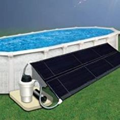 an above ground swimming pool with solar panels on the sides and a pump attached to it