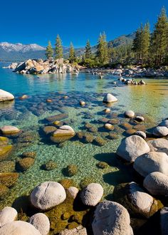 the water is crystal and clear with rocks in it