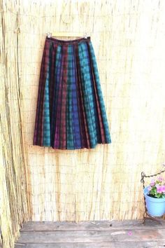 Rare Vintage Handmade Wool pleated skirt. Beautifully crafted. Plaids of Teal, pumpkin, indigo, fuschia and black .excellent condition W:26" H: 70" L:33" Multicolor Pleated Skirt For Fall, Vintage Accordion Pleats Skirt For Fall, Scottish Style Pleated Skirt For Fall, Fall Multicolor Pleated Skirt, Scottish Skirt, Purple Tartan Skirt, Wool Pleated Skirt, Vintage Wool Skirt, Vintage Pleated Plaid Skirt