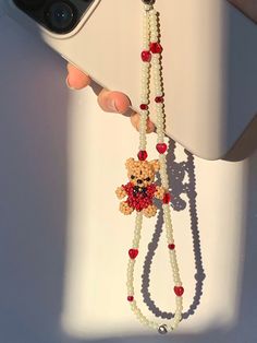 Phone Strap with Rouje (Red Teddy bear), ivory glass beads, heart glass beads. Teddy Bears are all handmade by us:) Length: 6.5~7.5 inches (including loop) Materials: Preciosa Crystal Beads, Glass Beads Rouje the teddy bear<3 Click below for more of our collections. https://www.etsy.com/shop/RebekahJewelry?ref=search_shop_redirect Care Instructions Our charms do not like to get wet nor like sitting out under the sun. Please keep away from all kinds of water/chemical and avoid exposure to heat/su Red Vintage Phone, Beaded Teddy Bear, Y2k Beads, Beaded Bear, Telephone Vintage, Vintage Phone, Strap Phone, Diy Embroidery Patterns