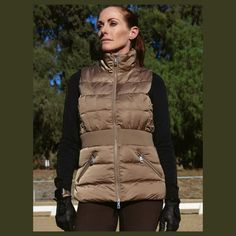 We're obsessed with the Maeve Quilted Vest! Made with water resistant, satin-like, insulated fabric to keep you warm and dry design features include: Contrast waistband provides a super flattering silhouette. Inner stretch cuffs. Custom diamond quilting. Features: Double Zippers Logo embroidery on chest Zip Pockets Care Instructions: Machine Wash Cold, Delicate Cycle, Dry Flat, Do Not Bleach Available in Champagne & Black Fitted Nylon Outdoor Outerwear, Fitted Nylon Outerwear For Outdoor, Fitted Nylon Sports Outerwear, Fitted Nylon Outerwear With Fleece Lining, Fitted Waterproof Outerwear For Winter Sports, Waterproof Fitted Outerwear For Winter Sports, Fitted Quilted Outerwear For Outdoor Activities, Fitted Waterproof Nylon Outerwear, Waterproof Fitted Nylon Outerwear