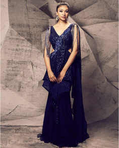 Draped in the captivating hues of blue, this gown saree is a canvas of elegance and opulence, adorned with floral embroidery, stones, sequins, and kardana beads for a touch of glamorous allure. Indian Bridal Couture, Indian Wedding Bride, Bridal Lengha, Embroidery 3d, Indian Bridal Lehenga, Indian Bridal Wear, Blue Gown, Stunning Gowns, Custom Bridal