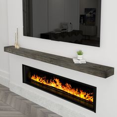 a fire place with a mirror on the wall