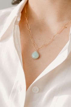 The Christine pendant necklace is bold with tons of personality. One single crystal pendant dangles from a large chain necklace. Choose your favorite stone pendant from amazonite, cherry quartz, or mother of pearl. The gold chain necklace is approximately 16 inches with 2 inch extender and the size of stone is approximately 1 cm. This small pendant necklace is perfect for every day wear and can be dressed up as well! Shop for your new favorite stone pendant necklace. Chic Gold-tone Delicate Chain Necklace, Elegant Quartz Crystal Necklace With Gemstone, Gold Quartz Necklaces With Natural Stones, Elegant Quartz Gemstone Necklace, 14k Gold-filled Crystal Necklaces With Delicate Chain For Gifts, Elizabeth Jewelry, Feminine Necklace, Jewelry Website, Stone Pendant Necklace