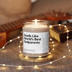 a candle that says smells like world's best copparents sitting on a table