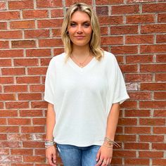 Introducing our chic and contemporary women's fashion top, where style meets comfort effortlessly. The cocoon sleeves add a modern twist, offering a relaxed yet flattering silhouette that drapes beautifully. Whether you're heading to a brunch date or a casual evening out, this versatile piece effortlessly transitions from day to night. Pair it with your favorite jeans for a laid-back vibe, or dress it up for a polished look. Fall Faves, Southern Women, Brunch Date, Casual Evening, Fashion Top, Oversized Tee, Short Rompers, Ladies Tops Fashion, Dress Romper