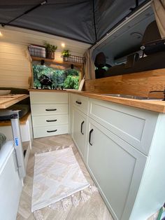 the kitchen is clean and ready to be used as a camper or home office