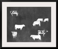 a black and white photo with cows painted on it