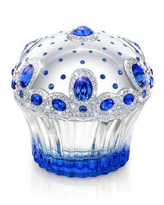 a blue and white glass crown on top of a table