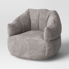 a beige chair with a round shaped cushion