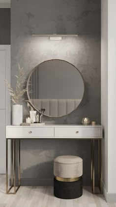 a white vanity with a round mirror and stool in front of it on the floor