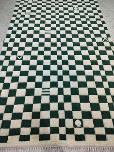 a black and white checkered rug on the floor