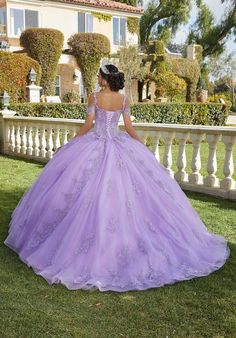 Princess quinceaera ball gown has a lovely Chantilly lace bodice with structured boning and stunning crystal beaded, embroidered lace appliqus that cascade down the sparkle tulle skirt. Appliqud straps and detachable off-the-shoulder sleeves create a cool, cold-shoulder look. Matching Stole included. Shown in Orchid, Bahama Blue, and Champagne! Quinceanera Dresses Damas, Lavender Quinceanera Dresses, Lavender Quinceanera, Damas Dresses, Quinceñera Dresses, Tulle Balls, Quince Dress, Dresses Quinceanera, Baptism Dress