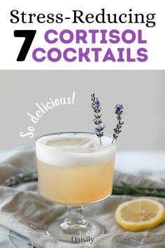 a glass filled with lemonade and lavender on top of a table