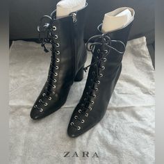 Black Leather Heeled Ankle Boots Nwot Size: Us 7.5/Eu 38 Never Worn Leather Upper Front Laces With Thirteen Pairs Of Metal Eyelets Round Lined Heel Almond-Shaped Toe Inner Side Zip Closure Sole Height: 3.5” (9cm) 5127/001/040 Leather Lace-up Boots With Pointed Toe And Reinforced Heel, Chic High Ankle Lace-up Boots For Evening, Lace-up Evening Boots For Fall, Winter Leather Heels With Pointed Toe, Elegant Black Lace-up Boots For Work, Leather High Ankle Heeled Boots With Wrapped Heel, Leather High Ankle Boots With Wrapped Heel, Pointed Toe Lace-up Boots With Leather Sole For Work, Chic Leather Lace-up Boots With Reinforced Heel